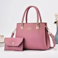Detailed view of pink leather tote bag with matching wallet and golden hardware - 2-Piece Set (28x12x20cm) / Pink