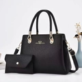 Close-up of black litchi pattern leather tote bag set with golden hardware and bow detail - Shoulder Bag Set / Black