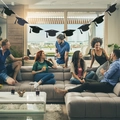 Graduation party banner featuring black mortarboard cap cutouts on a white string - Black Doctoral Cap Banner / Black