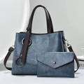 Retro blue-grey leather handbag set with tote, envelope pouch, and dark brown straps - Blue