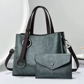 Detail view of dark teal tote bag and envelope clutch set with silver hardware - Green