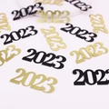 Golden and black 2023 number confetti decorations for New Year party tabletop - Black Gold Card 2026 Confetti