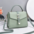 Litchi texture leather crossbody bag in mint green with golden heart buckle detail - Green