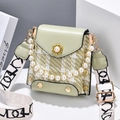 Light green crossbody bag in tweed and leather with pearl handle and wide woven strap - Green