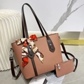 Close-up of pink litchi grain tote bag set with patterned scarf and small wallet - Pink