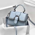 Light blue trapezoid shoulder bag in litchi grain leather with dark metal chain trim - Blue