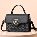 Fashionable black leather and M-print canvas crossbody bag with gold circular logo - Black