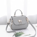 Light gray litchi texture handbag with cat pearl clasp and adjustable strap - Gray