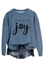 Close-up of Choose Joy print on blue crewneck sweatshirt with soft fabric texture - Blue (Black Font)