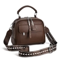 Detail view of coffee brown lychee textured leather bag with wide jacquard woven strap - 25cmx10cmx19cm / Coffee