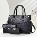 Three-piece black patent leather tote bag set with purple floral embossing and gold hardware - Purple