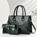 Green embossed faux leather 3-piece set featuring a large tote bag and two clutches - Green