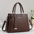 Deep brown pebble leather handbag with top handles and adjustable crossbody strap - Coffee