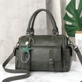 Deep green Boston handbag with textured leather, star charm, and detachable shoulder strap - Green