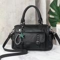 Detail of black litchi grain leather Boston bag with vintage studs and star charm - Black