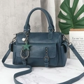 Detailed teal Boston bag featuring lychee grain texture and star pearl pendant charms - Blue