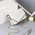 Ivory mini crossbody bag with white sequins and golden chain strap in elegant setting - Sequin Off-white