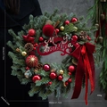 Detail of Christmas wreath with red bow, pine cones and Merry Christmas sign - Velvet Sign Style (45CM)