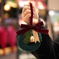 Christmas wreath ornament with burgundy velvet bow, golden bell, and pine branch detail - Green