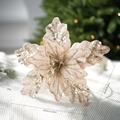 Champagne pink artificial poinsettia with gold glitter on a white knit blanket - Champagne