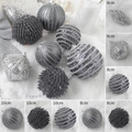 Detailed view of 8cm and 10cm silver and grey textured Christmas ornaments on snow - Grey Set