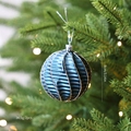 Deep blue 8cm Christmas ball with golden glitter waves on a festive tree branch - Blue Spiral Style