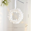 White glitter Christmas wreath ornament with ribbon hanging on a pine branch, 11cm diameter - Silver Garland Style (GJ69)