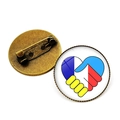 Silver peace badge with heart-shaped handshake in blue, yellow, white, and red flags - Bronze-Handshake Heart Flag Color (JY006303 Bronze-15)