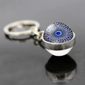 Portachiavi con sfera di vetro mandala blu e anello argentato su fondo riflettente - Motivo Mandala Blu Giallo (JY006341-7)
