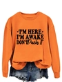 Detail of orange crewneck sweatshirt with black slogan print and ribbed cuffs - Orange (Black Font)