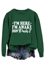 Detail of dark green sweatshirt featuring I'M HERE I'M AWAKE white slogan and stars - Dark Green (White Font)