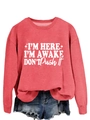 Detailed view of ribbed neckline and white slogan print on casual red crewneck sweatshirt - Red (White Font)