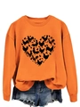 Detail of orange sweatshirt featuring a black heart-shaped chicken pattern and denim shorts - Orange Sweatshirt (Black Text Pattern)