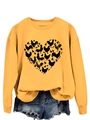 Detail of ginger yellow crewneck sweatshirt featuring a heart-shaped chicken and egg print - Yellow Sweatshirt (Black Text Pattern)