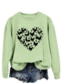 Macro detail of heart-shaped chicken and egg print on light green sweatshirt fabric - Olive Green Sweatshirt (Black Text Pattern)