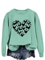 Detail of mint green sweatshirt featuring a black chicken heart silhouette graphic - Light Green Sweatshirt (Black Text Pattern)