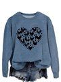 Detail view of blue sweatshirt featuring a heart-shaped chicken pattern and knit texture - Blue Sweatshirt (Black Text Pattern)
