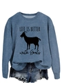 Close-up of blue crewneck sweatshirt featuring a black goat and slogan print - Blue (Black Font)