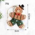 Omino pan di zenzero con cappello nero e pantaloni verdi per albero di Natale - Salopette