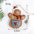 Lebkuchenmann-Anhänger aus Harz für den Weihnachtsbaum mit Maßen von 9cm Höhe - Schürze-Stil