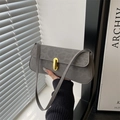 Modern grey suede rectangle shoulder bag with elegant gold twist lock hardware clasp - Gray