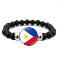 Elastic beaded bracelet featuring black polished beads and a Philippines flag glass pendant - Philippines