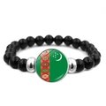 Turkmenistan flag beaded bracelet featuring glossy black beads and glass gem charm - Turkmenistan