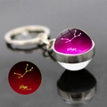 Portachiavi Vergine luminoso con sfera di vetro a doppia faccia e motivo a stelle viola - Vergine