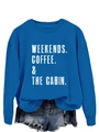 Flat lay of royal blue crewneck sweatshirt featuring white weekends coffee cabin print - Lake Blue Sweatshirt (White Letters)