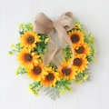 Artificial sunflower wreath with green leaves and a large striped linen bow decoration - Bowknot Sunflower Style