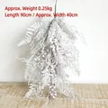 Detailed view of 90cm snow-flocked Christmas swag with red berries and pine needles - Hanging Flocked Swag 90cm