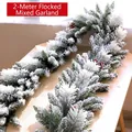Close-up of a 2m flocked mixed Christmas garland with pine cones and red berries - Flocked Garland 2m
