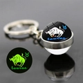 Porte-clés Zodiaque Taureau lumineux avec base en argent et effet fluorescent dans le noir - Taureau