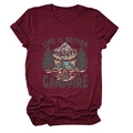 Detailed flat lay of maroon t-shirt featuring campfire and mountain graphic design - S / Burgundy